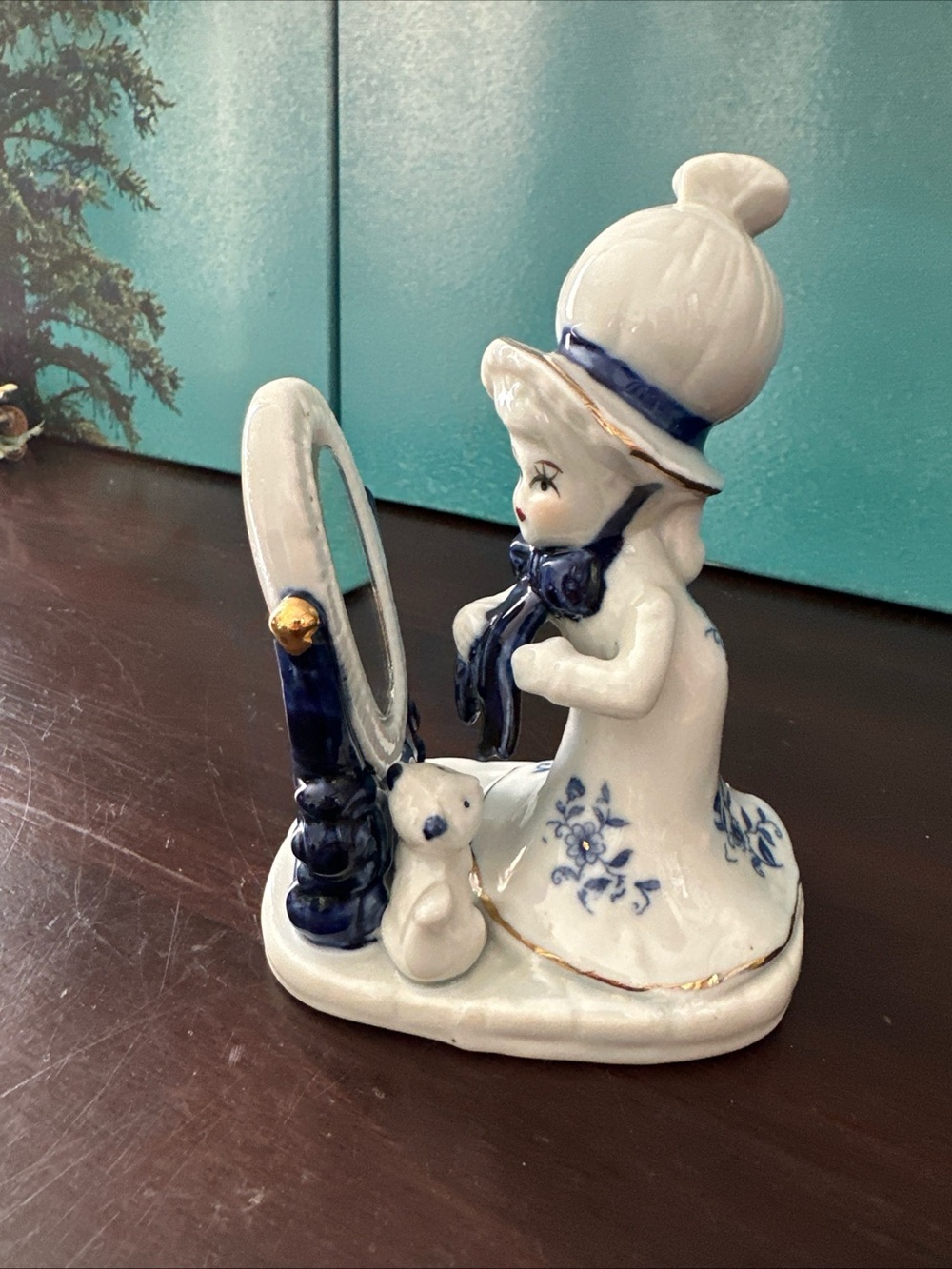 White and Blue Porcelain Figurine with Mirror and Teddy